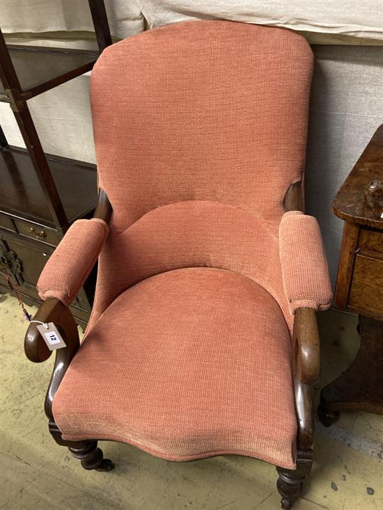 A mid Victorian mahogany scroll arm nursing chair